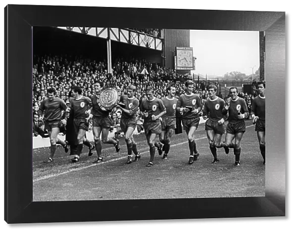 The Liverpool team on a lap pf honour with the Charity Shirld trophy after defeating