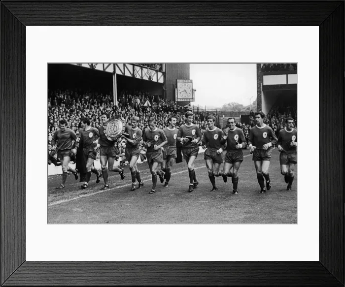 Framed Print : The Liverpool team on a lap pf honour with the Charity Shirld trophy after defeating