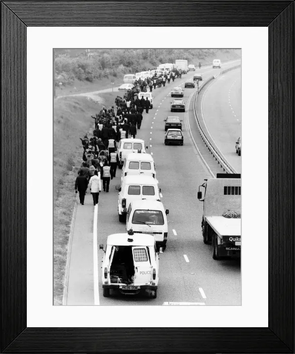 Framed Print : A hippy convoy now on foot due to Police moving them off Framed Print : A hippy convoy now on foot due to Police moving them off