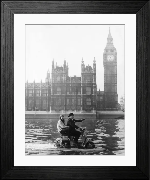 Framed Print : Skipper and stella Hornsby sail up the Thames on their scooter at a fair rate of knots Framed Print : Skipper and stella Hornsby sail up the Thames on their scooter at a fair rate of knots