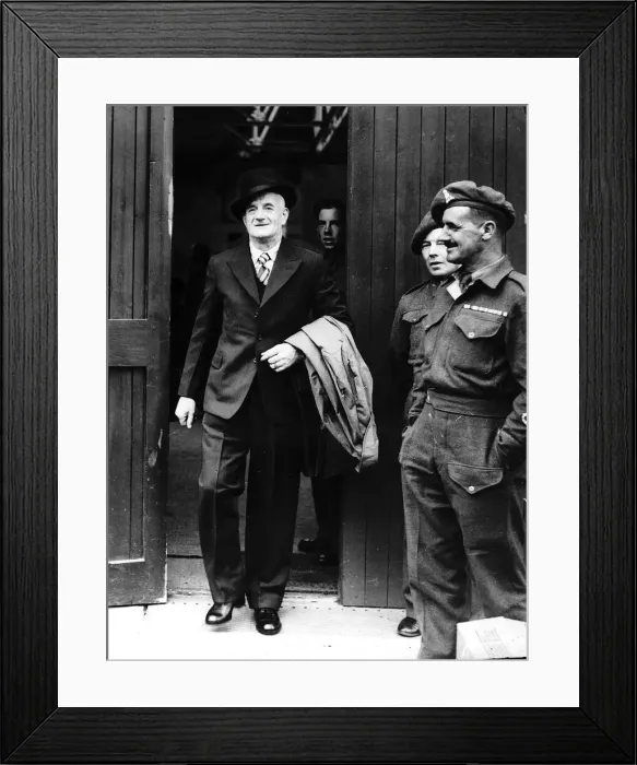 Framed Print : World War Two - Discharged soldier leaving clothes store wearing his demob clothes June Framed Print : World War Two - Discharged soldier leaving clothes store wearing his demob clothes June