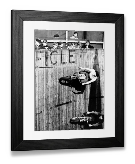 Framed Print : Margy Dare passes her colleague dare devil Jake during their Fly on the ceiling act
