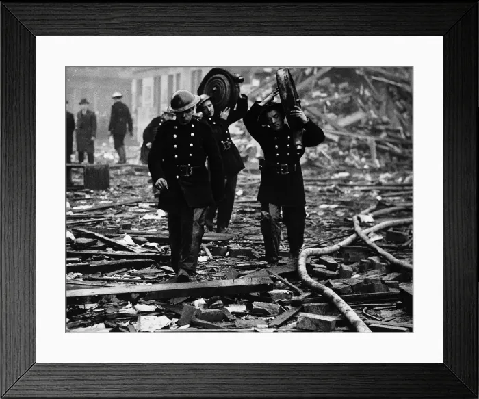 Framed Print : World War Two Firemen carry their hoses through the rubble after an air raid Framed Print : World War Two Firemen carry their hoses through the rubble after an air raid