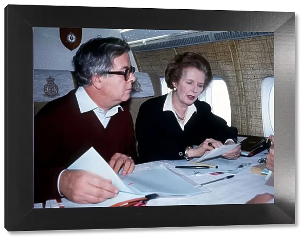 Margaret Thatcher MP prime Minister with Geoffrey Howe MP sit on a plane on their way to