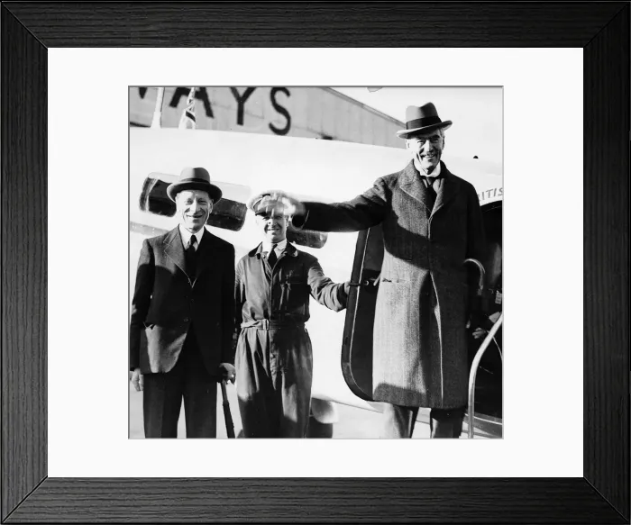 Framed Print : Prime Minister Neville Chamberlain steps off a plane wearing an overcoat and a hat Framed Print : Prime Minister Neville Chamberlain steps off a plane wearing an overcoat and a hat