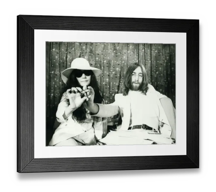 Framed Print : John Lennon and Yoko Ono at London airport presenting acorns they intend sending to heads Framed Print : John Lennon and Yoko Ono at London airport presenting acorns they intend sending to heads