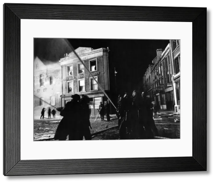 Framed Print : War-Air Raids on London call firefighters to scene