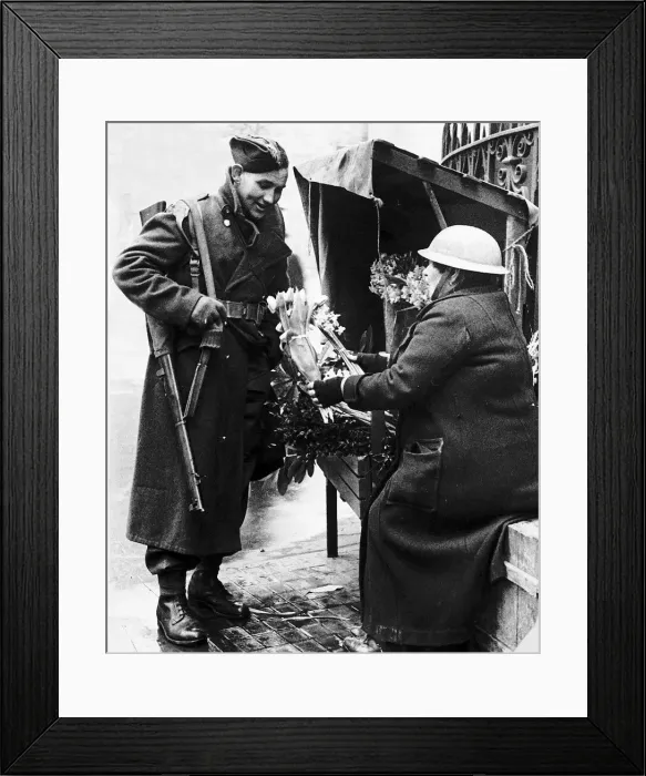 Framed Print : Soldier buying flowers from well protected flower seller during WW2