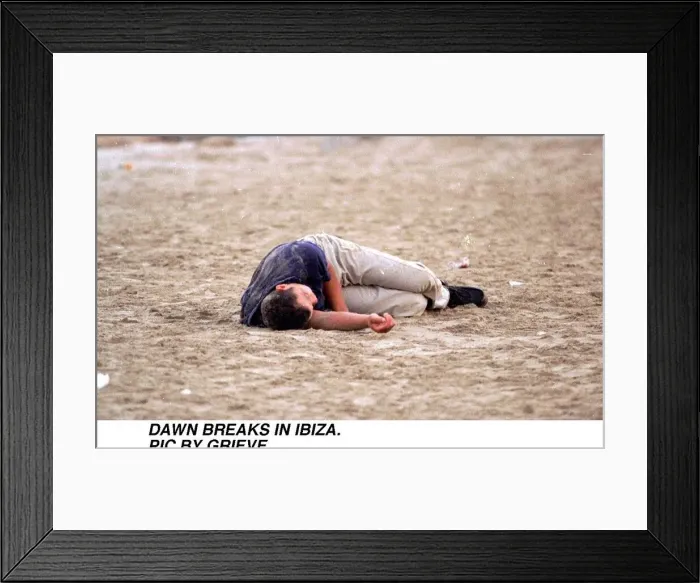 Framed Print : Dawn breaks in Ibiza Spain Drink Drunk youth Young man sleeps it off on the beach Framed Print : Dawn breaks in Ibiza Spain Drink Drunk youth Young man sleeps it off on the beach