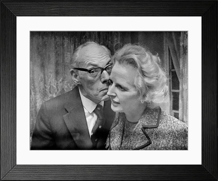 Framed Print : Margaret Thatcher with Denis Thatcher who kisses her on the cheek - February 1975 Framed Print : Margaret Thatcher with Denis Thatcher who kisses her on the cheek - February 1975