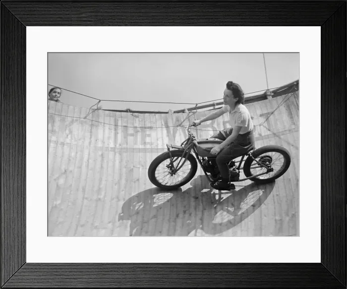 Framed Print : Margy Dare riding a motorbike around the Wall of Death at Morecambe in Lancashire Framed Print : Margy Dare riding a motorbike around the Wall of Death at Morecambe in Lancashire