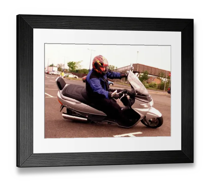 Framed Print : Suzuki Burgman 400 motorbike June 1999 being driven round corner