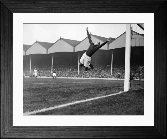Framed Print : Manchester City goalkeeper Frank Swift making an athletic save in a league match against Framed Print : Manchester City goalkeeper Frank Swift making an athletic save in a league match against