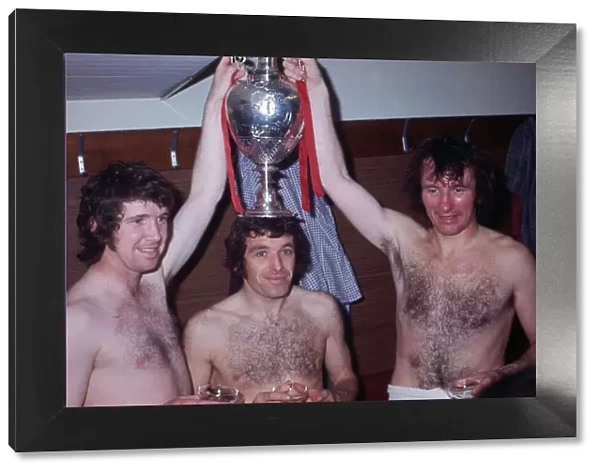 Liverpool players Chris Lawler, Ian Callaghan and Tommy Smith celebrate wiing the League