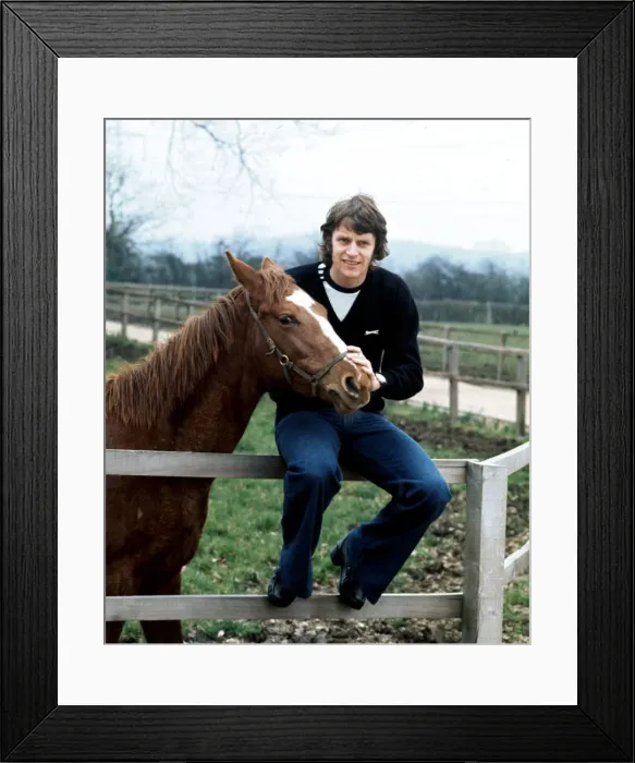 Framed Print : Southampton footballer Mick Channon pictured with one of his racehorses at his farm