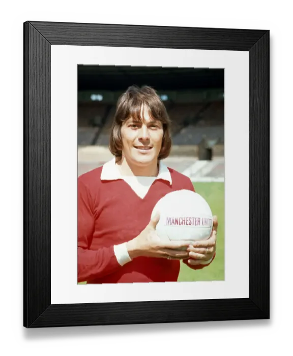 Framed Print : Manchester United footballer Stuart Pearson poses with the team football at Old Trafford Framed Print : Manchester United footballer Stuart Pearson poses with the team football at Old Trafford