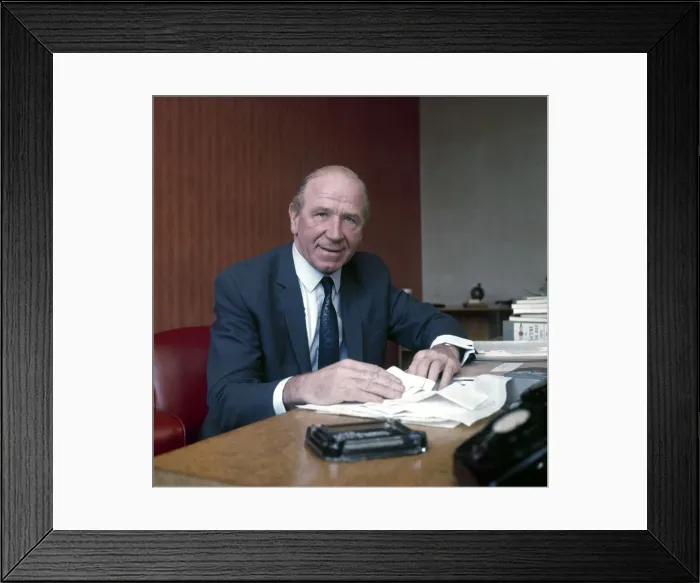Framed Print : Manchester United manager Sir Matt Busby sitting at the desk in his office at Old
