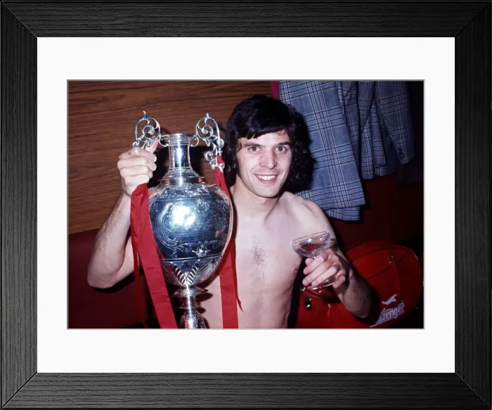 Framed Print : Liverpool player Peter Cormack celebrates winning the League Championship with the trophy