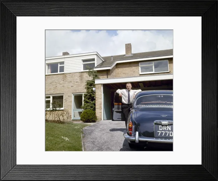 Framed Print : Chelsea manager Tommy Docherty at home with his car on the driveway May 1967