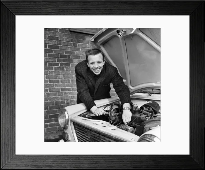 Framed Print : Nobby Stiles Manchester United player seen here tinkering with the engine of his car 8th