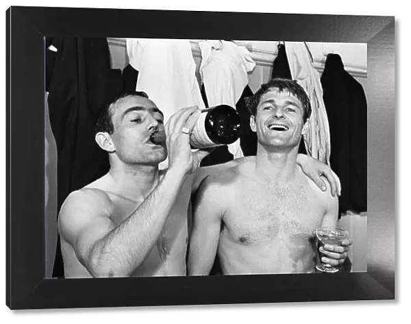 Ian St John of Liverpool drinks champagne 1966 with Roger Hunt after winning