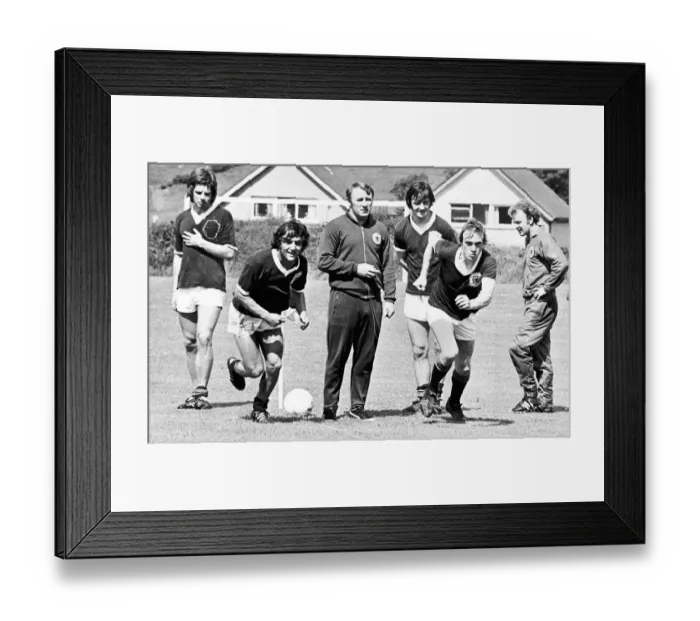 Framed Print : Scottish footballers Lou Macari and Colin Stein race each other as team boss Tommy Framed Print : Scottish footballers Lou Macari and Colin Stein race each other as team boss Tommy