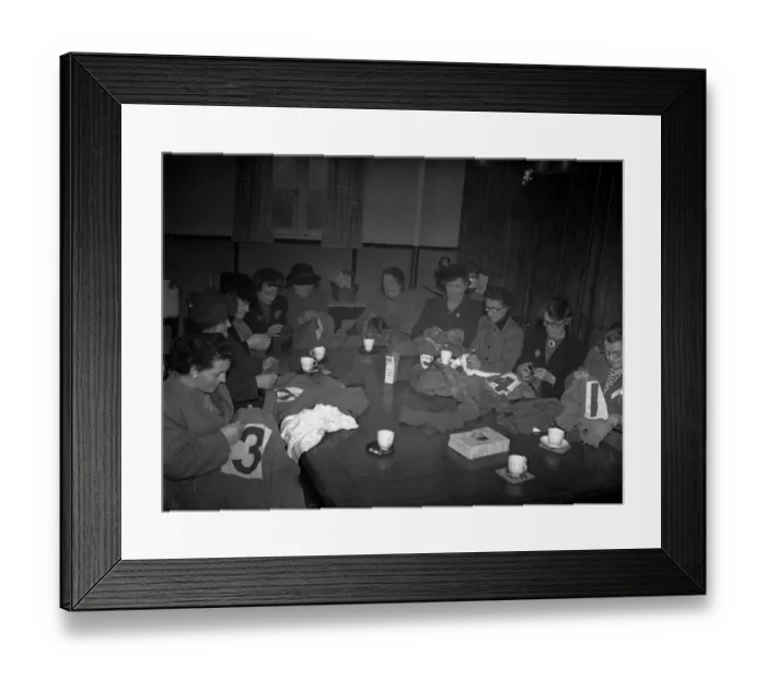 Framed Print : Women mend the shirts of Yeovil Town football club as they preapre for their upcoming