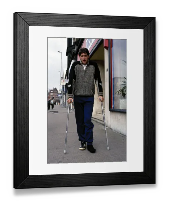Framed Print : Footballer Ted McMinn in crutches after an injury on the football field September Framed Print : Footballer Ted McMinn in crutches after an injury on the football field September
