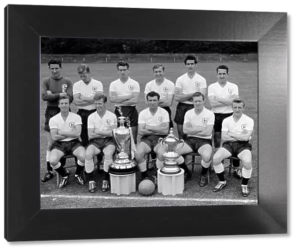 The Double winning Tottenham Hotspur football team pose with the League Championship