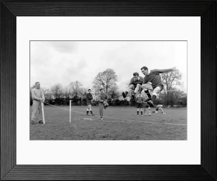 Framed Print : Tottenham Hotspur players Terry Dyson and Les Allen jumping over the rope in training Framed Print : Tottenham Hotspur players Terry Dyson and Les Allen jumping over the rope in training