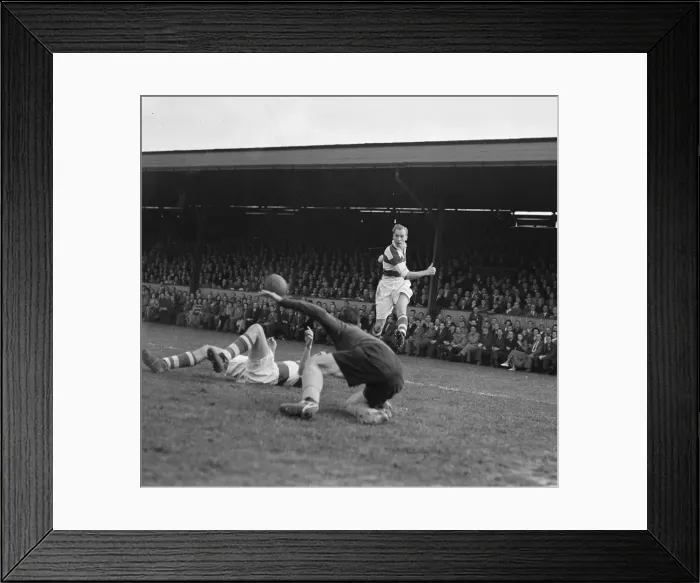Framed Print : QPR striker seen here in a goal mouth melee, tries an attempt on goal
