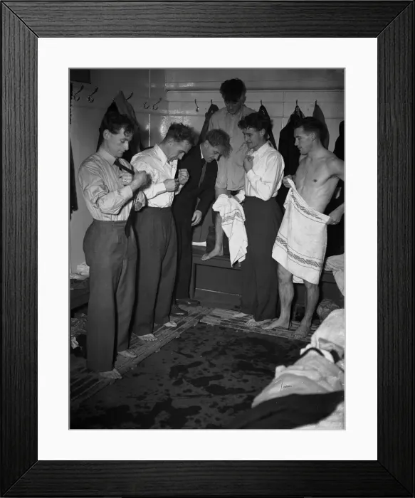 Framed Print : England players changing after practice for match against Belgium