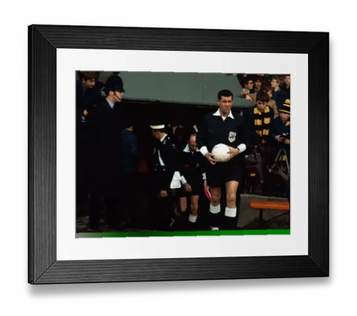 Framed Print : English referee Jack Taylor enters the pitch before taking charge of n English league