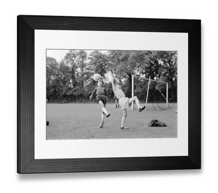 Framed Print : Members of the Tottenham Hotspur team training. Children of the Spurs players make