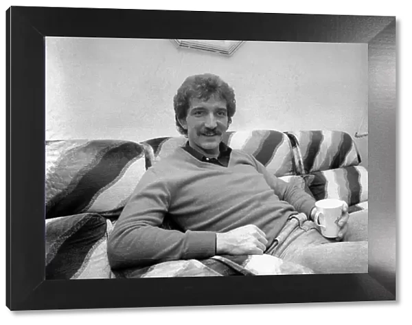Liverpool footballer Graeme Souness relaxes at home witha cup of tea