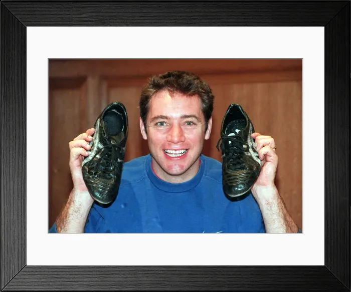 Framed Print : Ally McCoist actions football boots for Cash For Kids. Charity November
