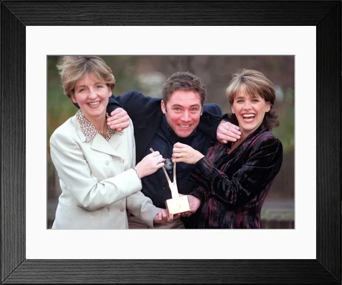 Framed Print : Ally McCoist Ranger football player appears to fight over the BAFTA award with TV Framed Print : Ally McCoist Ranger football player appears to fight over the BAFTA award with TV