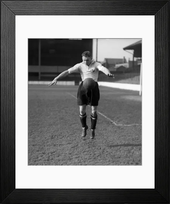 Framed Print : Bill Nicholson of Tottenham Hotspur practices his ball control during a team training Framed Print : Bill Nicholson of Tottenham Hotspur practices his ball control during a team training