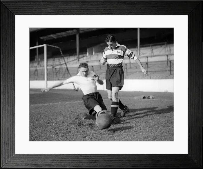 Framed Print : Bill Nicholson of Tottenham Hotspur performs a sliding tackle on teammate Freddie Cox Framed Print : Bill Nicholson of Tottenham Hotspur performs a sliding tackle on teammate Freddie Cox