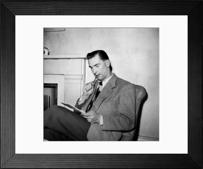 Framed Print : Jackie Milburn, at the Buxton Palace hotel, in pensive mood, writing to his wife Laura Framed Print : Jackie Milburn, at the Buxton Palace hotel, in pensive mood, writing to his wife Laura