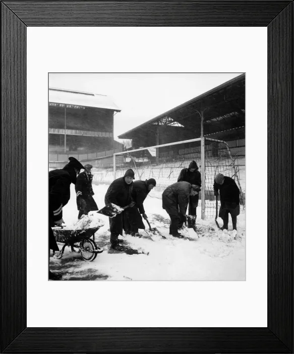 Framed Print : Snow Scene. Ground staff at White Hart Lane clearing the pitch for the FA Cup semi final Framed Print : Snow Scene. Ground staff at White Hart Lane clearing the pitch for the FA Cup semi final