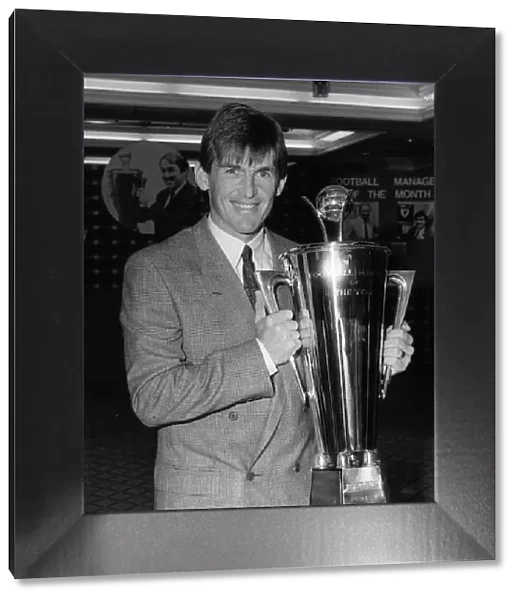 Kenny Dalglish of Liverpool with Manager of Year Cup 1986