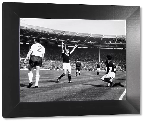 Denis Law celebrating Jim Baxter goal against England April 1963