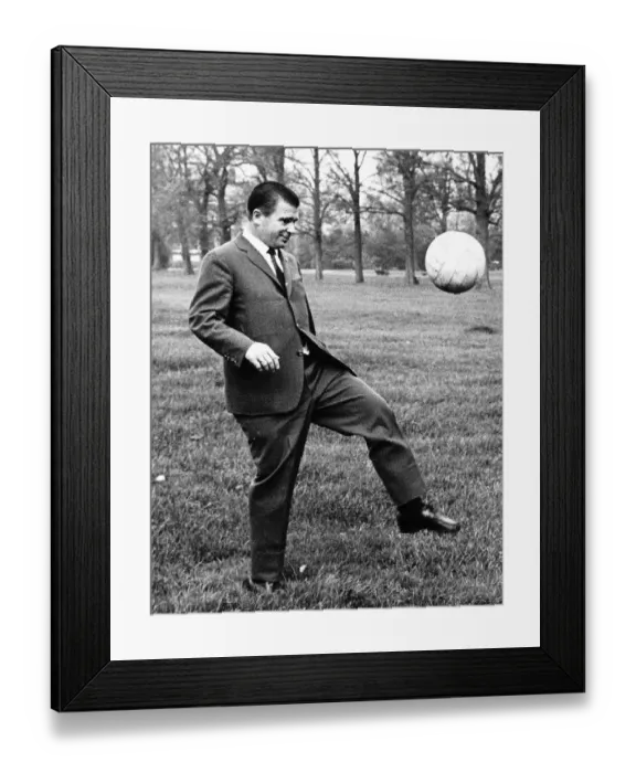 Framed Print : Ferenc Puskas of Real Madrid football club kicking ball in Kensington