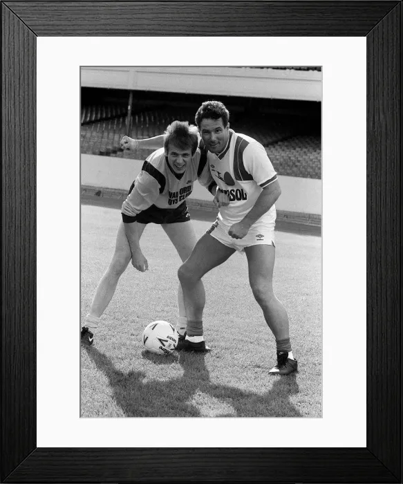 Framed Print : Derek Hatton MP with actor Tom Watts practice for 1987 charity football match