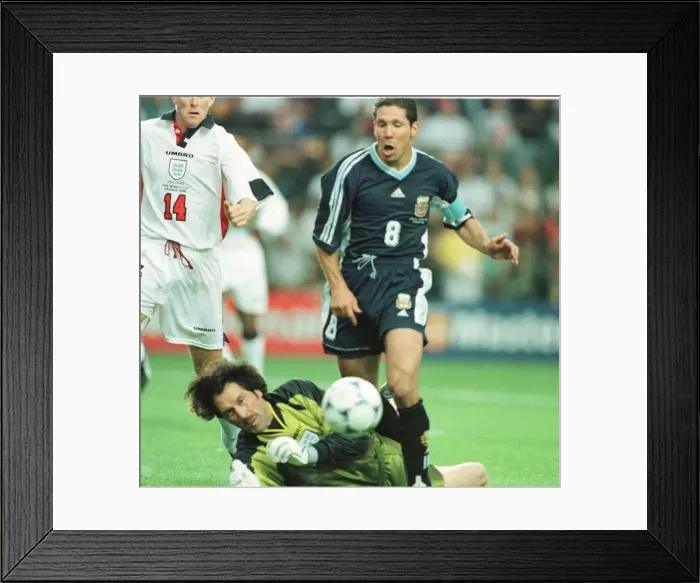 Framed Print : David Seaman brings down Diego Simeone June 1998 of Argentina for the first