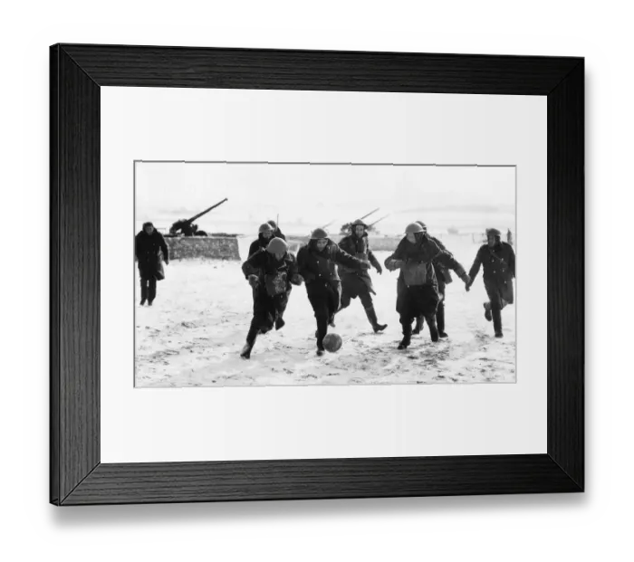 Framed Print : British anti aircraft battery playing football in a snow-covered French field. WW2 1940