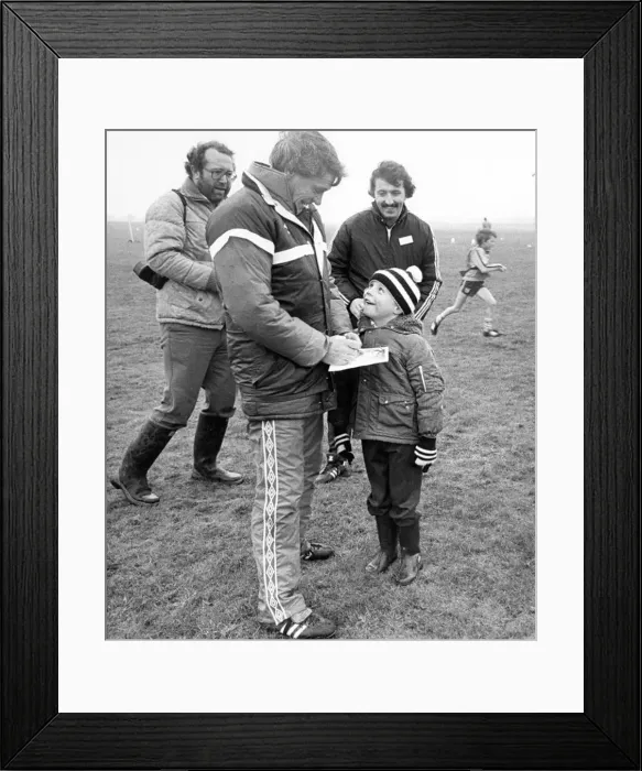 Framed Print : England manager Bobby Robson obliges a young fan in Newcastle