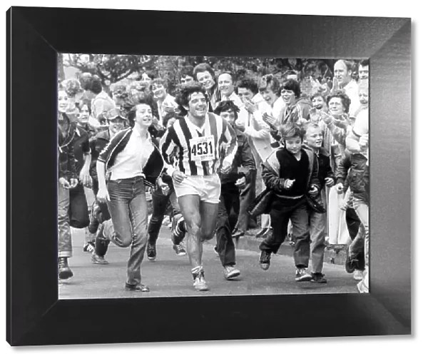 Newcastle player Kevin Keegan is joined by supporters on the Great North Run, in 1981