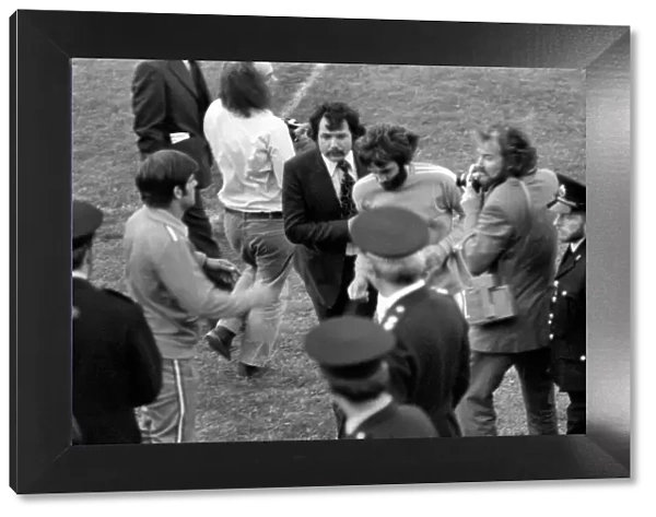 George Best being escorted off the pitch by Manager Barry Fry